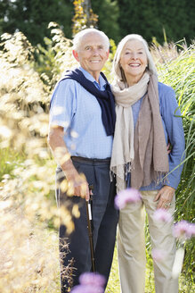 Older couple standing together outdoors - CAIF02182