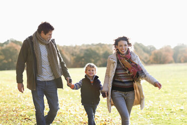 Family walking together outdoors - CAIF02337