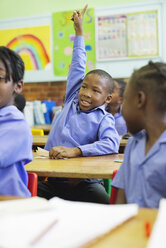 Student raising hand in class - CAIF02477