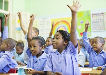 Students raising hands in class - CAIF02486