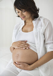 Pregnant woman holding her belly - CAIF02690