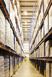 Aisle of boxes in warehouse - CAIF02794