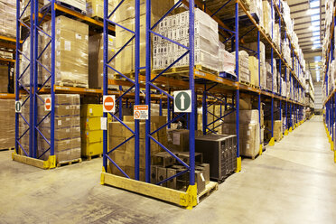 Aisles of boxes in warehouse - CAIF02807