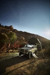 Africa, Namibia, Spitzkoppe, starry sky, off-road vehicle with roof tent - CVF00195