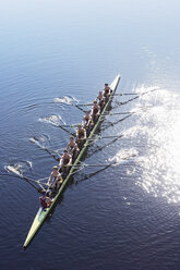 Rowing team rowing scull on lake - CAIF03239