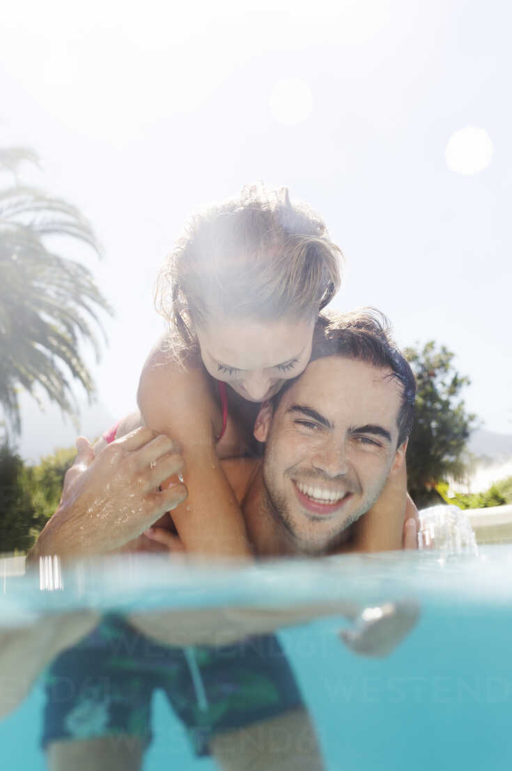 Couple stood together in swimming pool Stock Photo | Adobe Stock