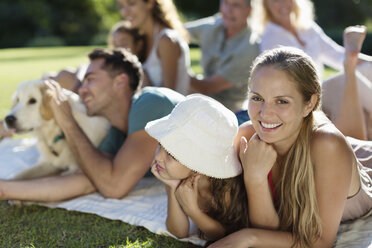 Family relaxing in backyard - CAIF03345