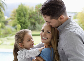 Family smiling together outdoors - CAIF03347