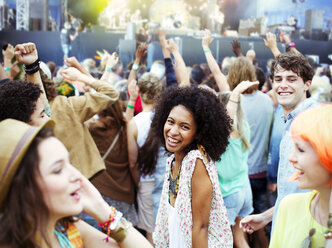 Fans dancing and cheering at music festival - CAIF03637