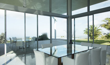 Glass table and chairs in modern office - CAIF03652