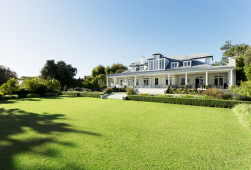 Luxury house facing sunny lawn - CAIF03677