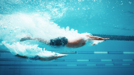 Swimmers racing in pool - CAIF03805