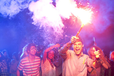 Fans with fireworks at music festival - CAIF03920
