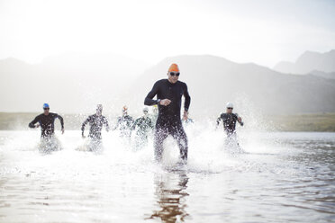 Triathletes emerging from water - CAIF04087