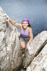 Climber scaling rock face - CAIF04107