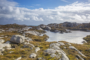 Sunny clouds over craggy rocks and water, Golden Road, Harris, Outer Hebrides - CAIF04135