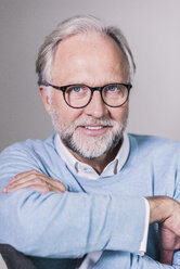 Portrait of mature man with and grey hair and beard wearing glasses - UUF12949