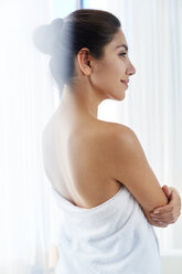 Serene woman wrapped in towel - HOXF00058