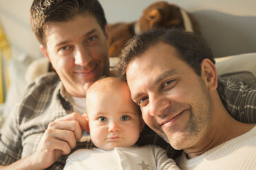 Portrait smiling male gay parents and cute baby son - CAIF04283