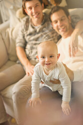 Portrait cute baby son with male gay parents - CAIF04339