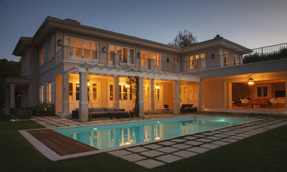 Illuminated luxury house with swimming pool at night - HOXF00206