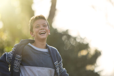 Laughing boy outdoors - HOXF00579