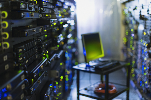 Computer on cart in server room corridor stock photo