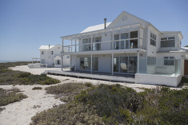 White beach house under sunny blue sky - HOXF00958