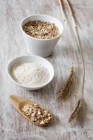 Rye ears, rye flakes, rye flour and rye grains stock photo
