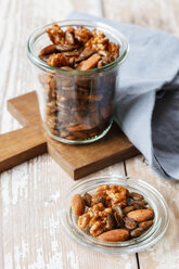 Homemade roasted flavored nuts, almonds, walnuts and pumpkin seeds in glass - EVGF03301