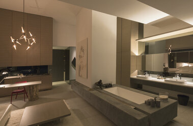 Illuminated modern, luxury home showcase interior bathroom - HOXF01092