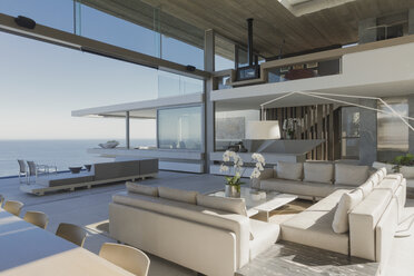 Modern, luxury home showcase interior living room with ocean view - HOXF01256