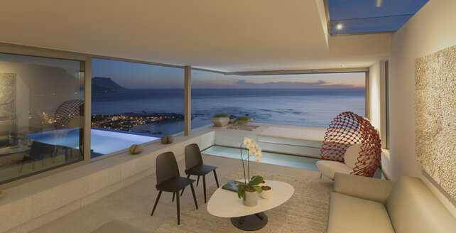Beleuchtetes modernes, luxuriöses Haus mit Wohnzimmer und Pool mit Blick auf das Meer in der Dämmerung - HOXF01265