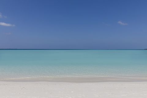 Seascape view blue tropical ocean under sunny blue sky stock photo