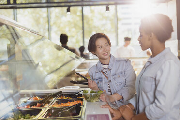 Young lesbian couple at salad bar in market - HOXF01580