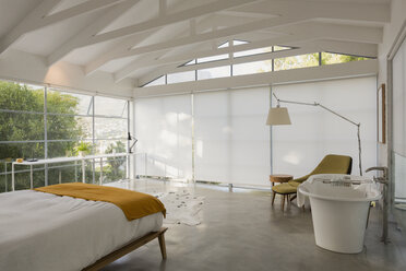 Modern, minimalist home showcase interior bedroom with vaulted ceiling - HOXF02413