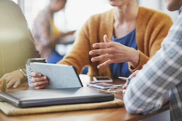 Business people with digital tablet meeting at cafe table - HOXF02729