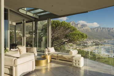 Sunny modern luxury home showcase balcony with mountain view - HOXF02922
