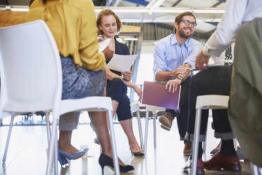 Business people meeting in circle - HOXF02942