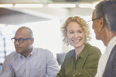 Businesswomen talking in office - HOXF03027