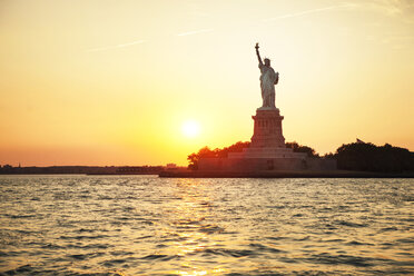 Statue of Liberty and river against clear sky during sunset - CAVF00472