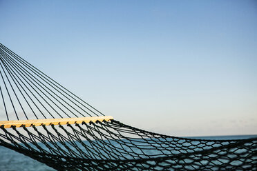 Close-up of hammock by sea against clear sky - CAVF00474
