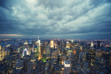 High angle view of illuminated cityscape against cloudy sky - CAVF00639