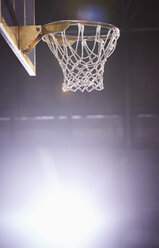 Lens flare around brightly lit basketball hoop - CAIF05481