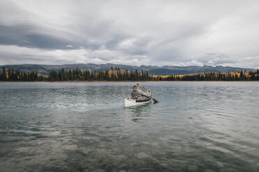 Canada, British Columbia, man in canoe on Boya Lake - GUSF00499