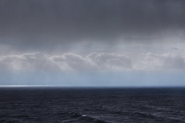 Clouds and rain over ocean seascape - CAIF05918