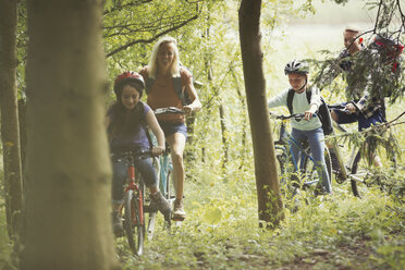 Family mountain biking in woods - CAIF06053