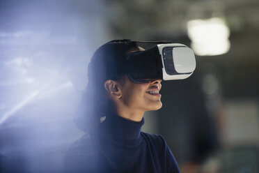 Businesswoman using virtual reality simulator - CAIF06162