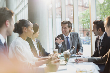 Businessman talking, leading conference room meeting - CAIF06262