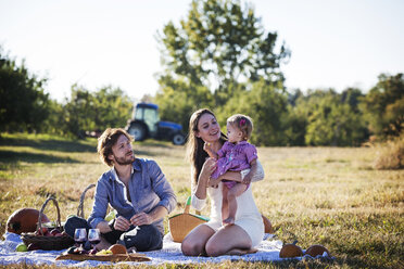 Family enjoying picnic on sunny day - CAVF01287